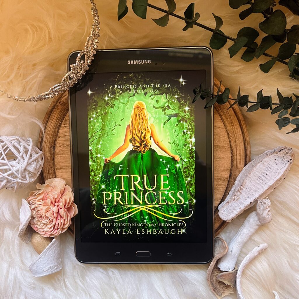 Flat lay highlighting the book True Princess by Kayla Eshbaugh on a pleasing background of neutral colors